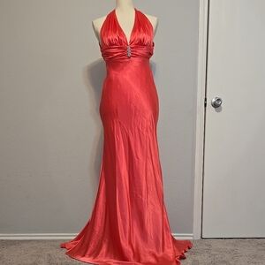 Hot pink maxi gown with ruched bodice halter neckline for prom